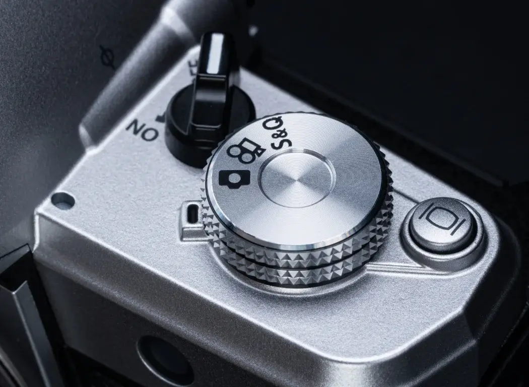 Close up photo of the OM SYSTEM OM-3's Quick & Slow video switch.